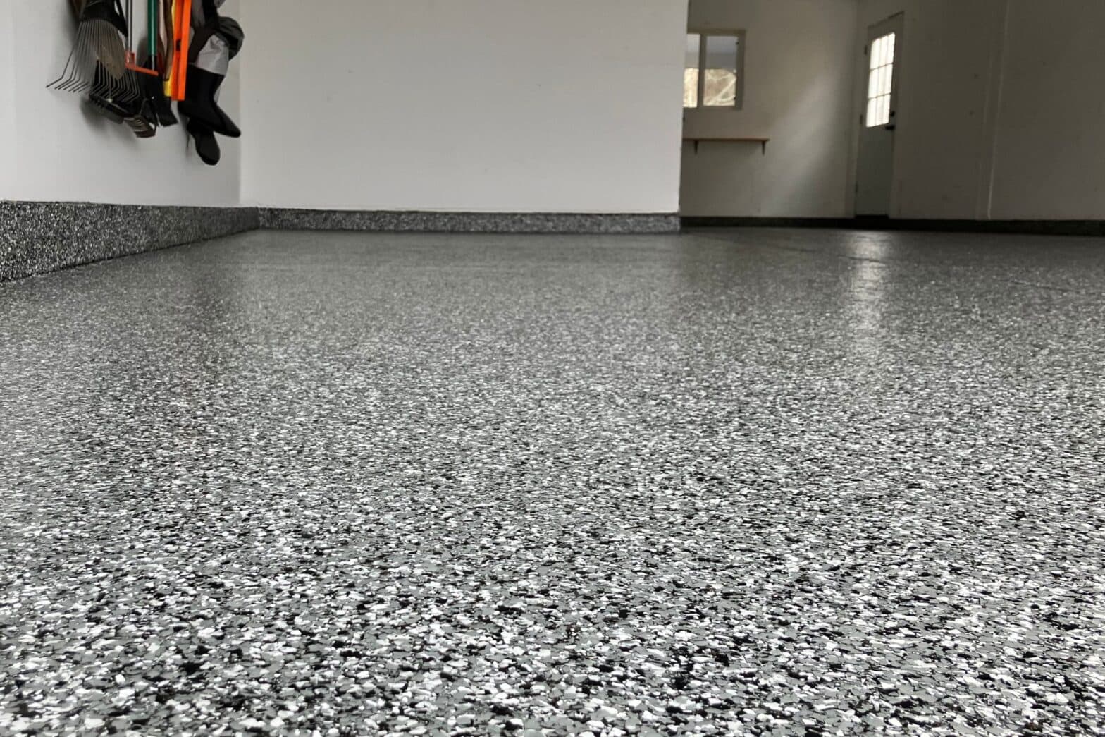 Gray fleck epoxy garage floor coating completed by Tacho Painting LLC in NC