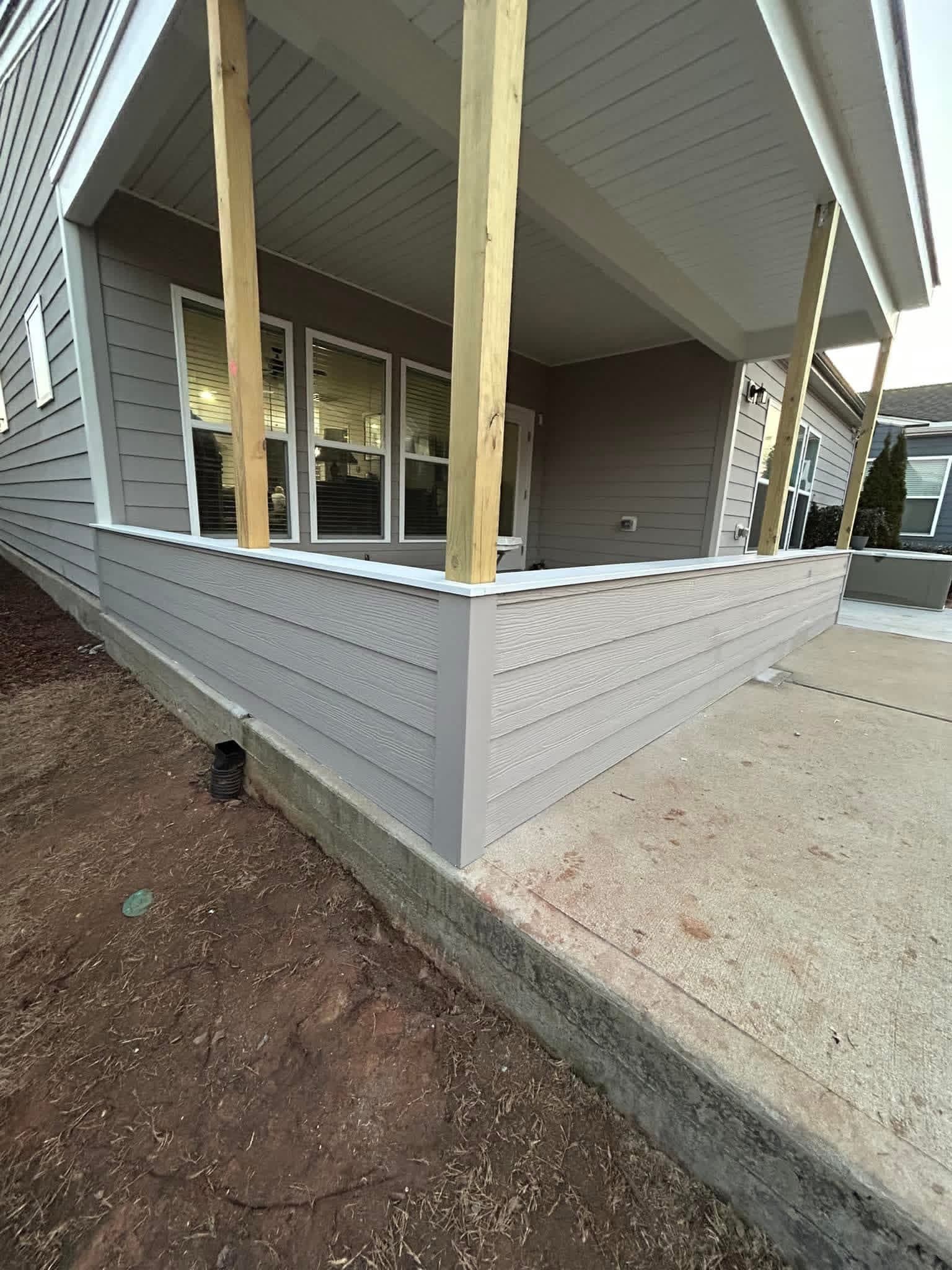 New construction porch siding and trim painted gray by Tacho Painting LLC in NC